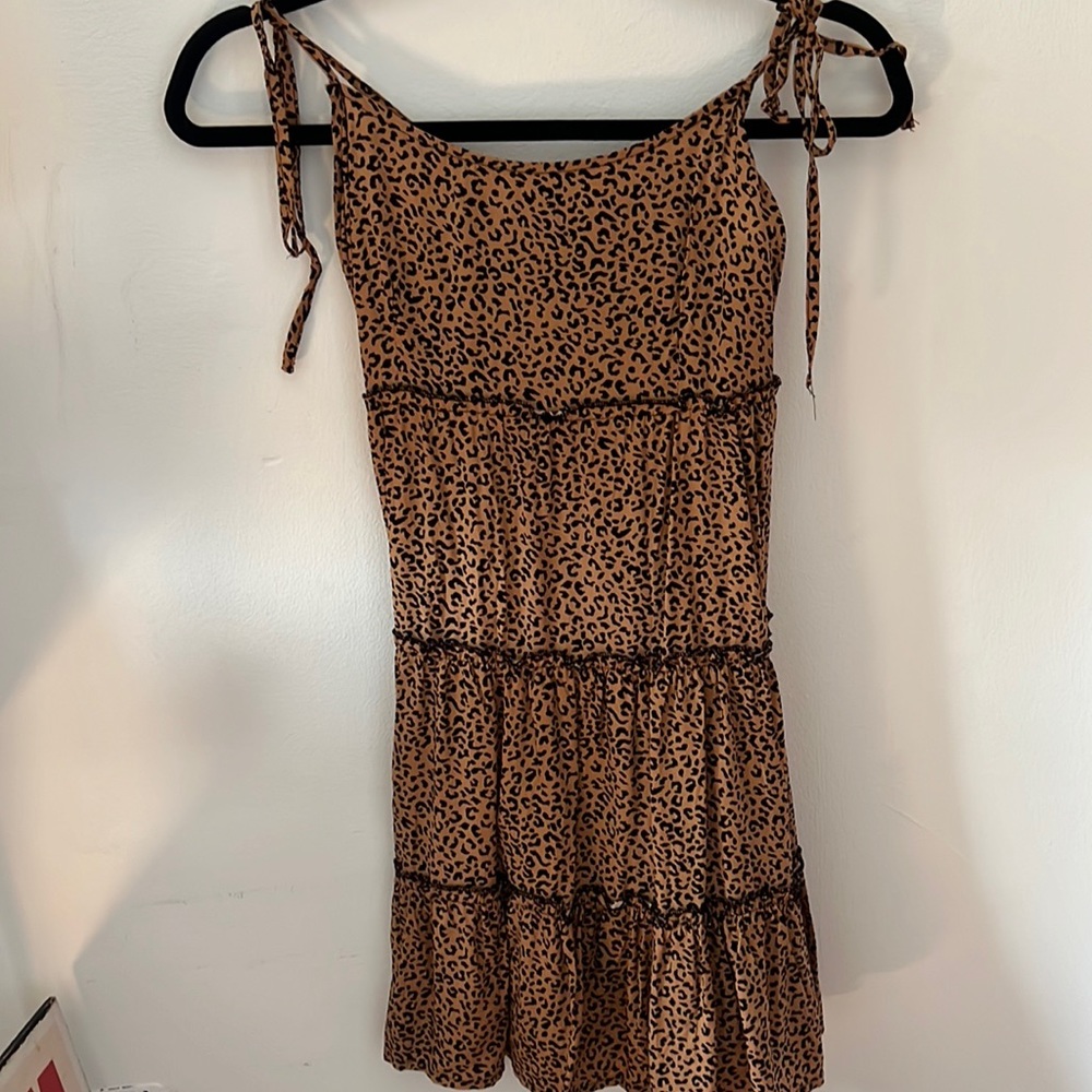A size small cheetah sun dress. Never worn. Super cute.